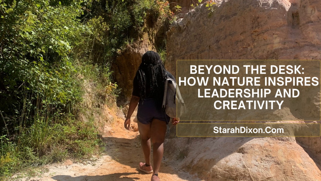 A woman with long braids wearing a backpack walks through a scenic, rocky trail surrounded by greenery under natural sunlight. The banner text reads, "Beyond the Desk: How Nature Inspires Leadership and Creativity," with the website "StarahDixon.Com" displayed below.